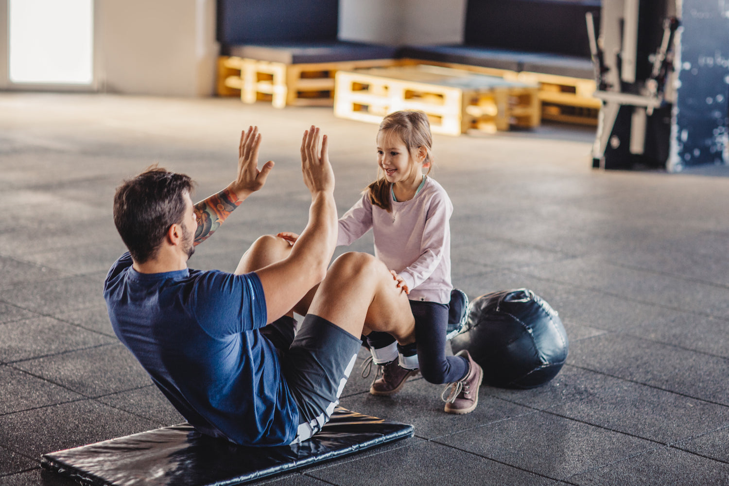 dad working out with his daughter